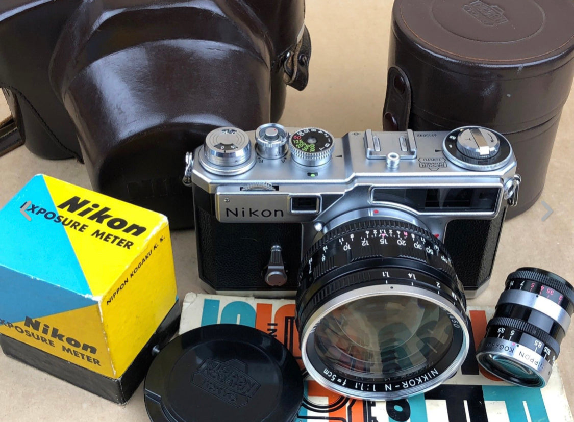 Vintage Nikon rangefinder camera with Nikkor lenses and Nikon exposure meter